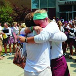 Photograph by Claire Frisbie. Jennifer Buckman embraces theology teacher, Mrs. Ralph, in one last hug as an official Assumption High School student.